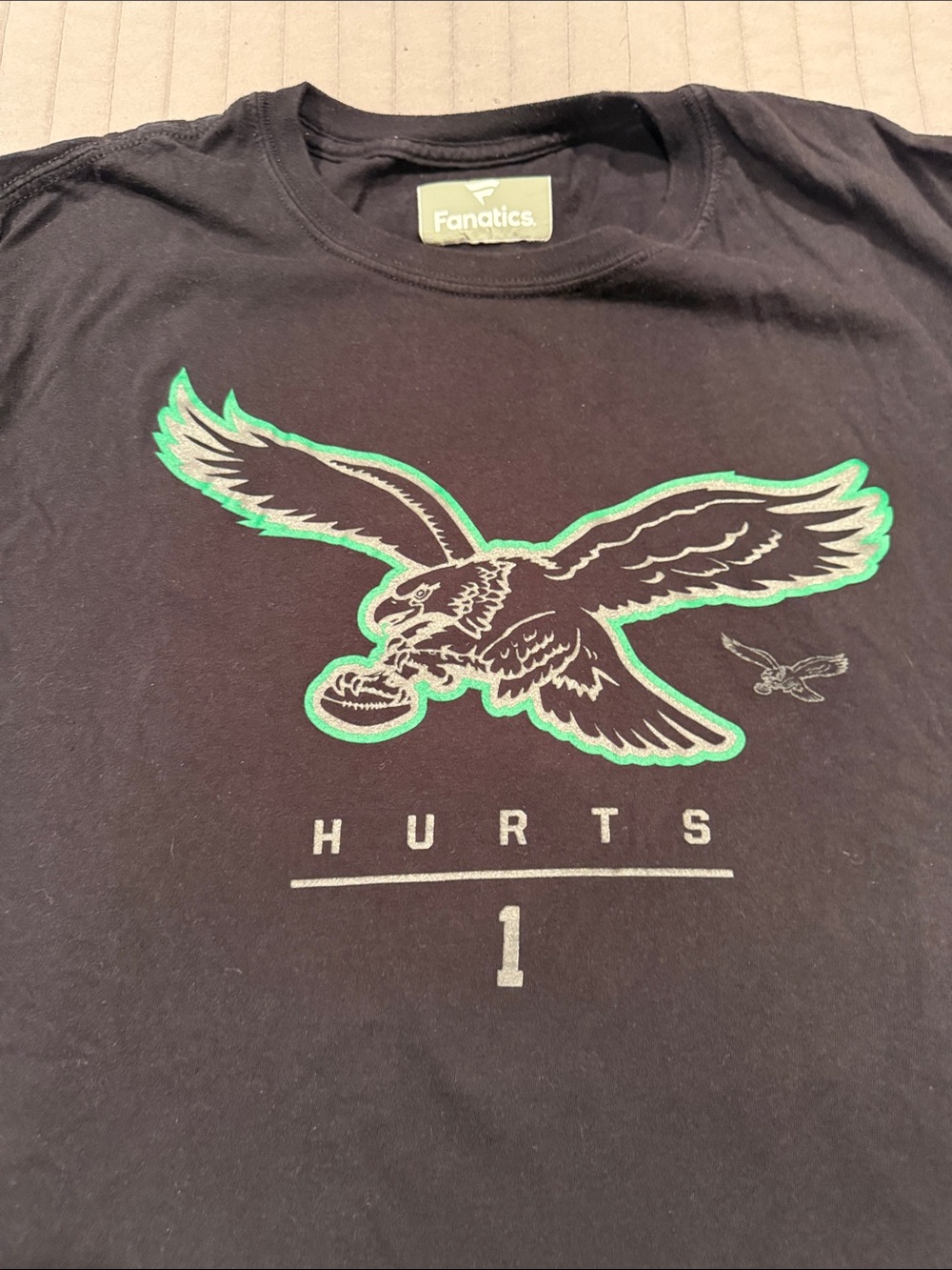 Fanatics Black Tee with Green-Accent Eagles Graphic and 'Hurts 1' Print